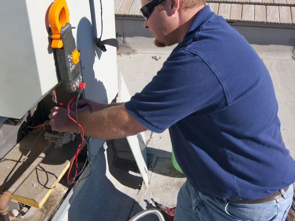An hvac tech installing a piece
