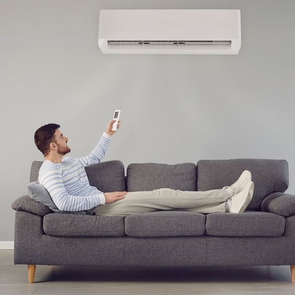 person controlling ductless AC