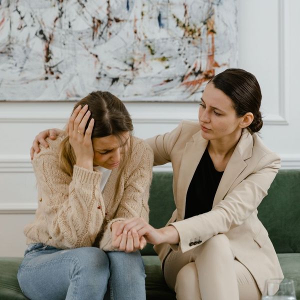 therapist comforting woman