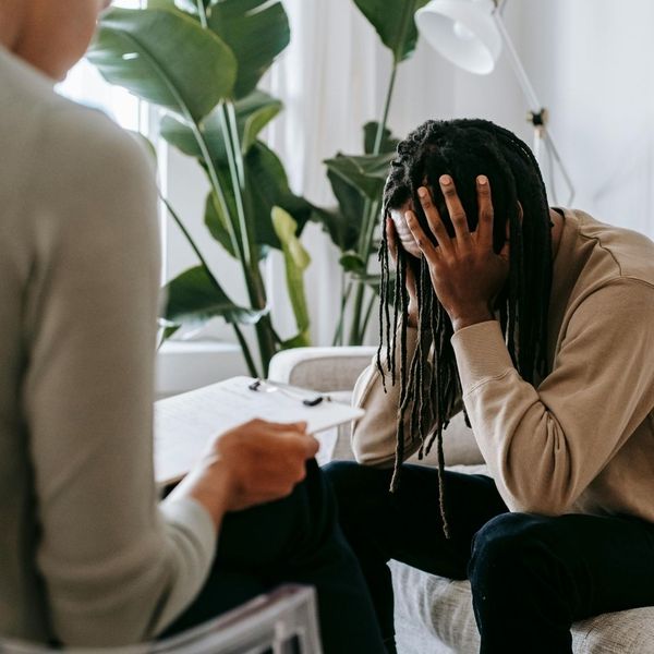 distressed man at therapy