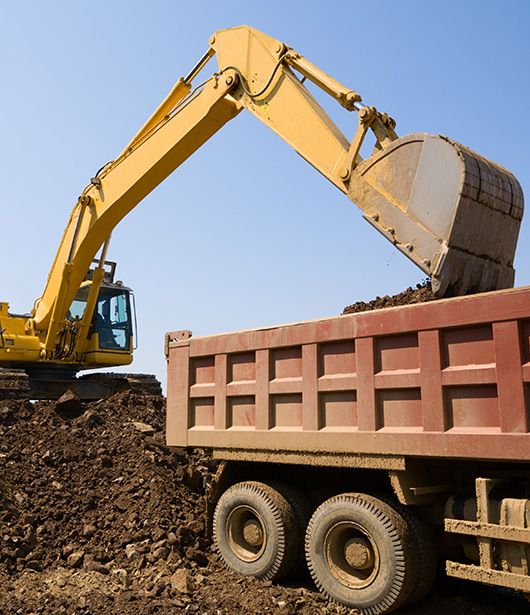 Image of a rolloff dumpster with dirt