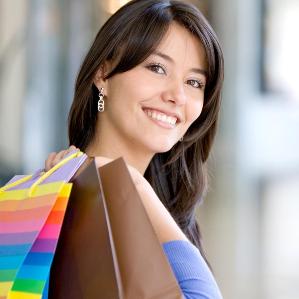 Happy woman carrying shopping bags