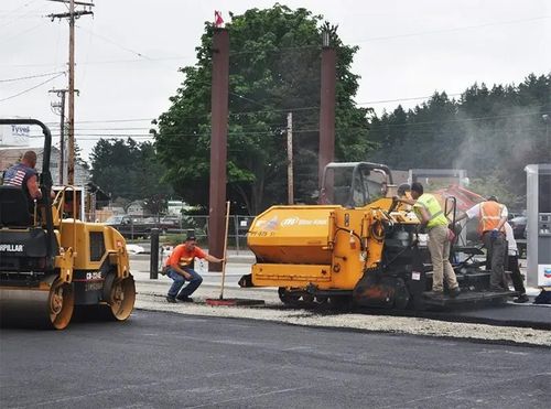 Image of workers asphalt paving