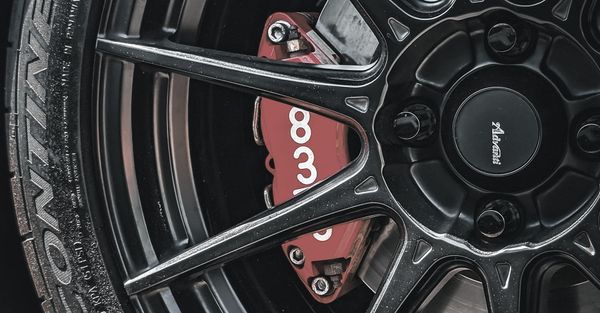 Close up of a sports car's wheels and brakes