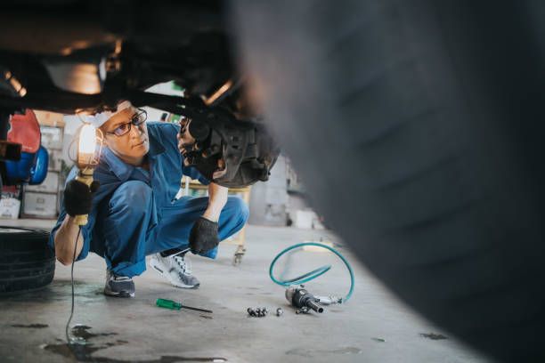 A mechanic checking a car's brakes