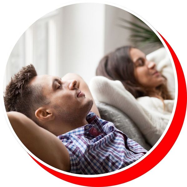 comfortable couple laying on couch