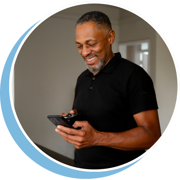 older man smiling using smartphone older man smiling using smartphone