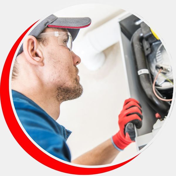 HVAC tech inspecting heater