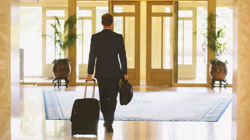 man leaving a hotel man leaving a hotel