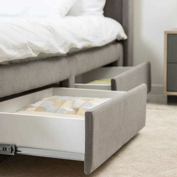 bed with storage drawers underneath. 