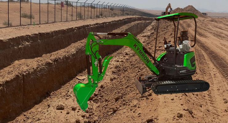Kymron mini excavator with a dirt background