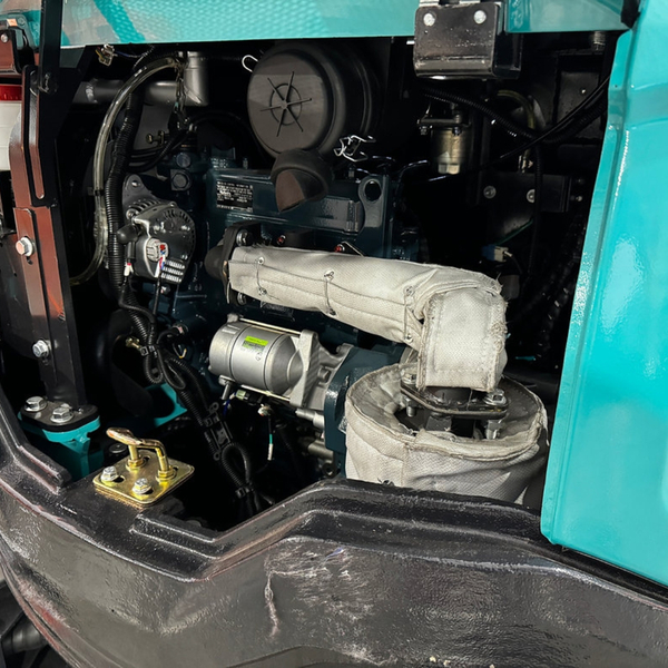 A close-up view of a powerful and clean engine inside a mini excavator.