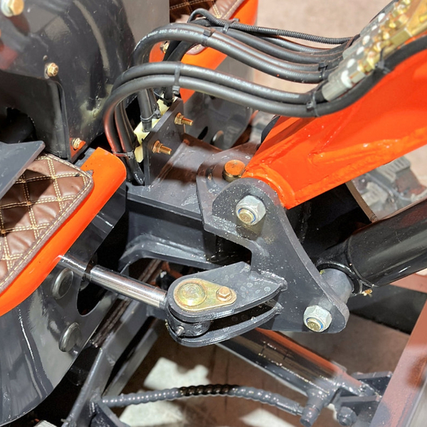 An M Cross C Equipment technician provides expert service on a piece of machinery.