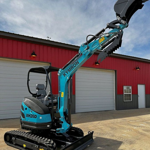 Kymron mini excavator outside warehouse