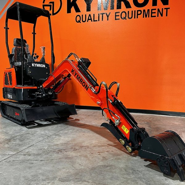 A versatile Kymron mini excavator being used for a residential landscaping project.