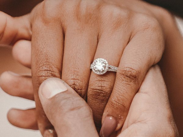 close up of engagement ring on woman's hand