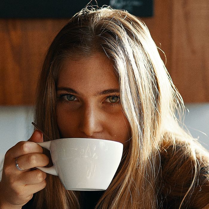 a girl drinking coffee