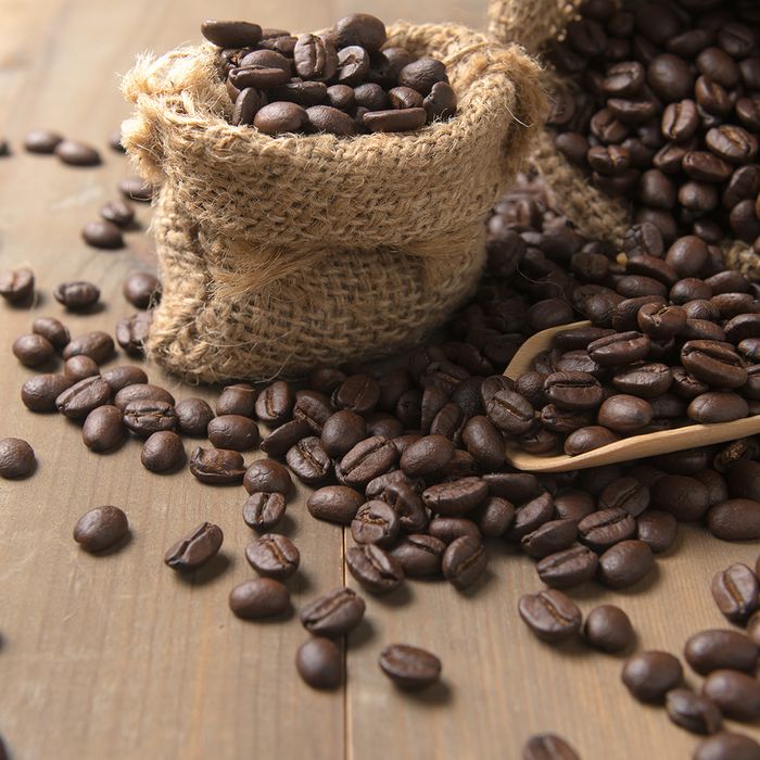  An image of roasted coffee beans in a burlap sack.