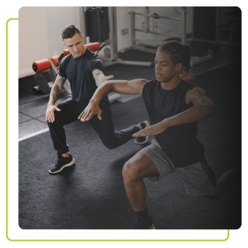 personal trainer helping client with form