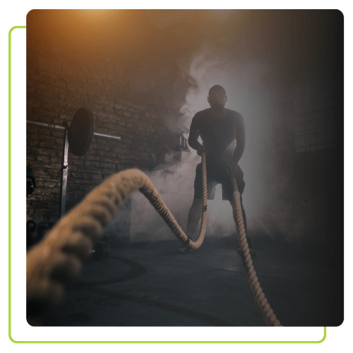 man working out with battle ropes