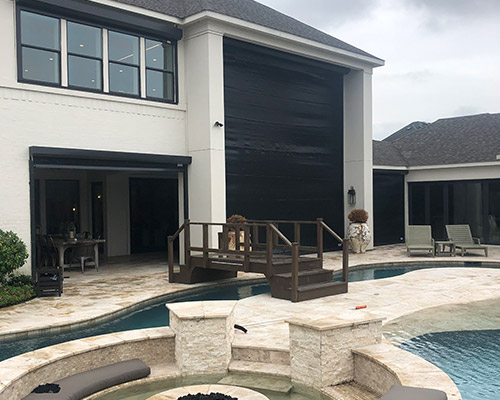 Hurricane fabric offers a cost-effective and simple way to increase hurricane protection measures around your home exterior. These high-strength, flexible, and transparent hurricane fabric panels are designed to withstand the strongest hurricane-force winds and to deflect large and small debris objects. Hurricane fabric window protection still allows natural light and visibility while effectively protecting against high winds and driving rain. Once the storm passes, hurricane fabric panels can be folded up and put into storage without any hassle. Hurricane Fabric