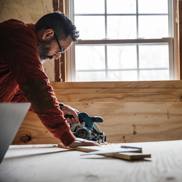 Man cutting plywood. 