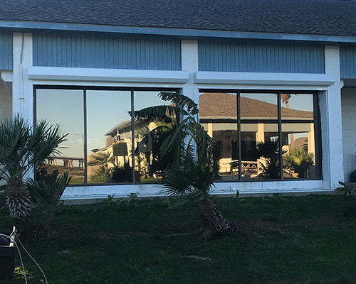 Our hurricane window film provides 24-hour, passive protection against severe weather, accidents, and vandalism by holding shattered glass fragments in place. Applying this protective film on your windows can help protect the glass from completely breaking and will prevent water and wind-borne debris from entering inside. If high winds or debris hit one of your windows and cause it to break, the durable window film will keep the glass in place and will not allow the glass to pop out of the frame. Window Film