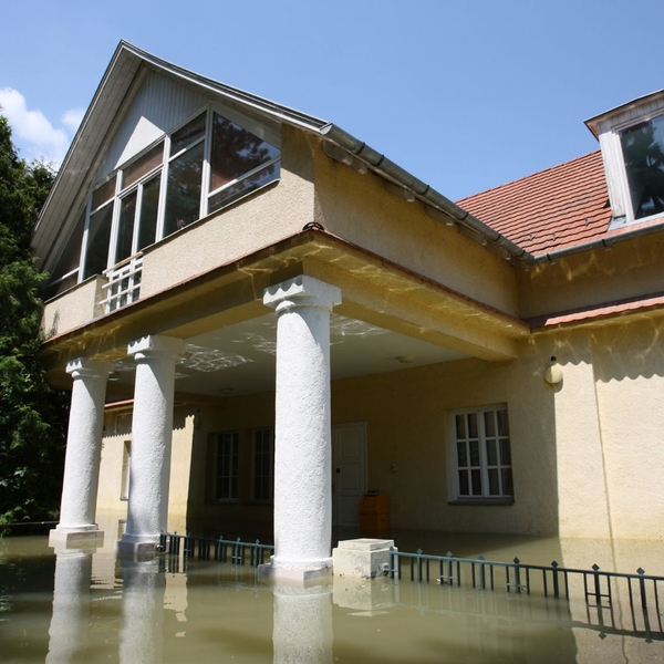 Home surrounded by flood water