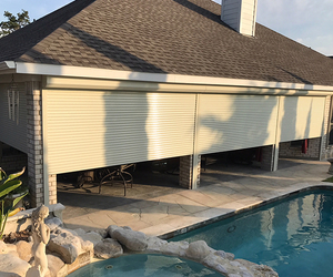 110v motor that can be controlled by a wired switch or handheld remote Automatic Rolling Shutters