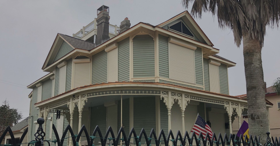 An image of a house with shutters from Houston Hurricane & Security Products.