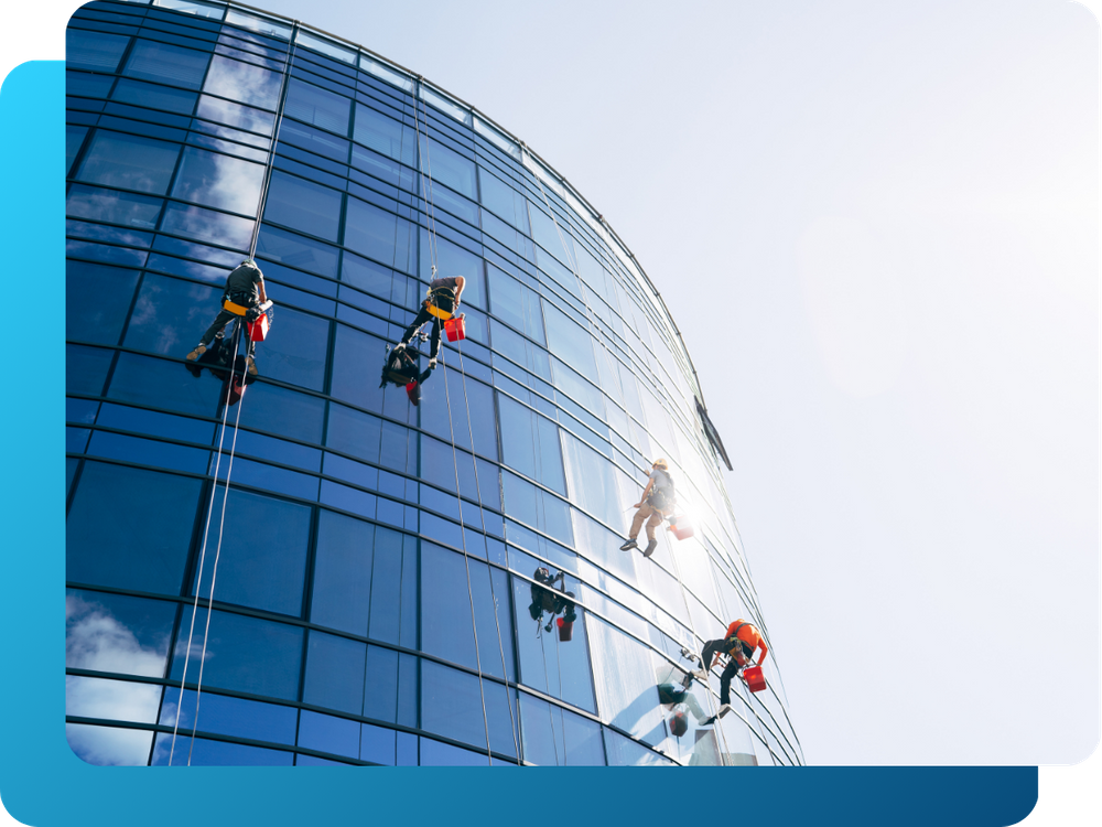 crew members window cleaning on a highrise building