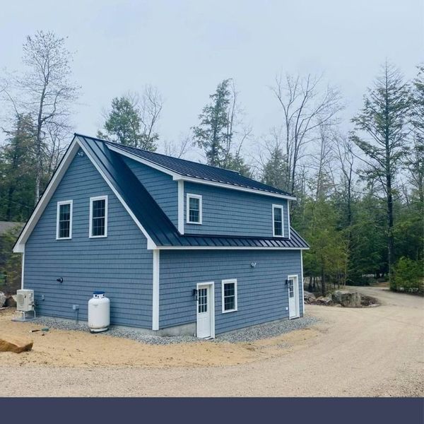 house with fresh and new blue siding