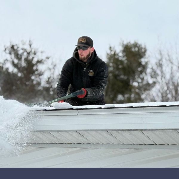 removing snow off of a roof