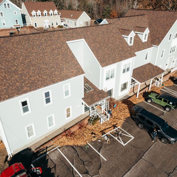 overhead view of condos / apartment complex with large roof