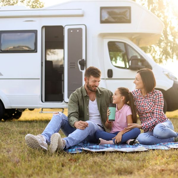 family in front of RV