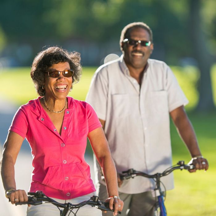 smiling couple on bikes