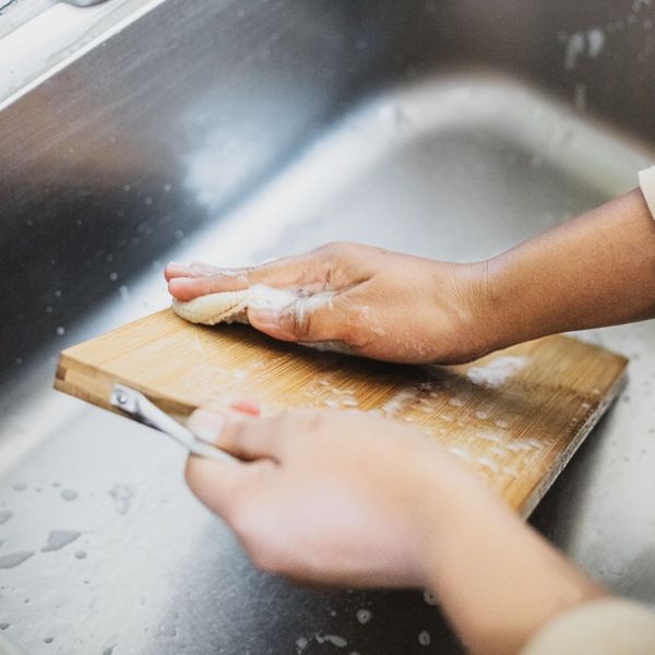 Washing a cutting board. Washing a cutting board.