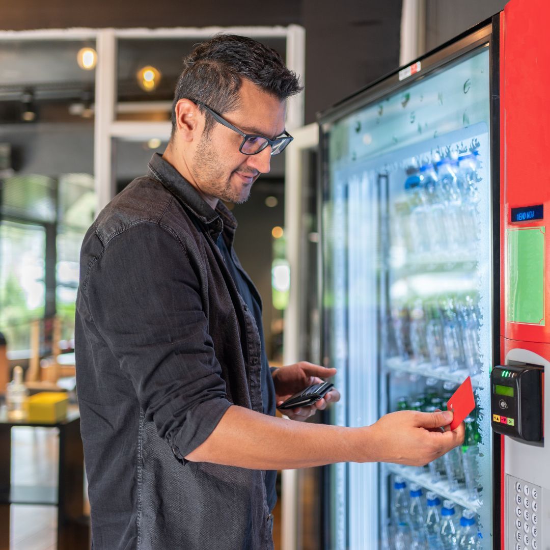 man using vending machine