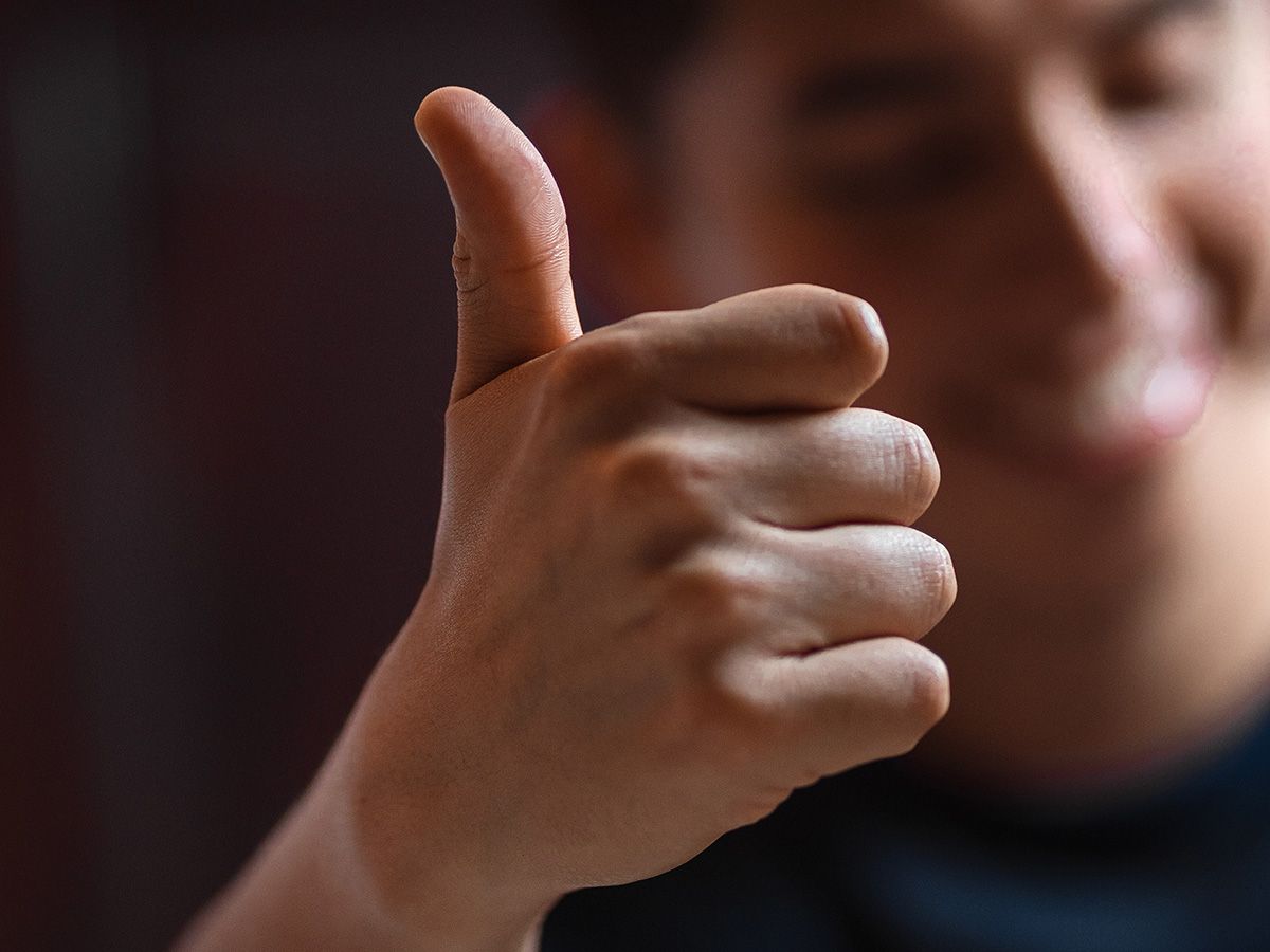 Image of a man giving a thumbs up