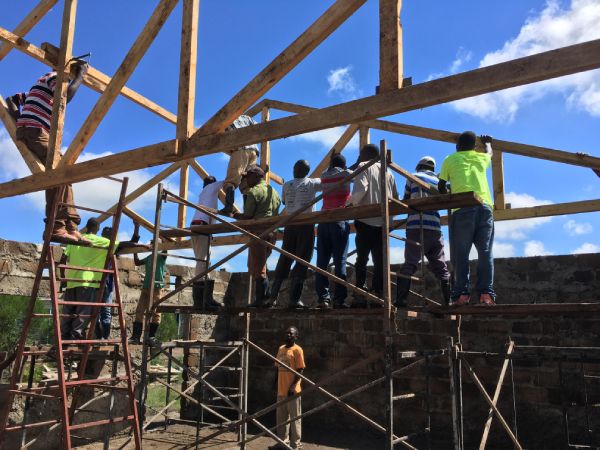 Saruni International participants constructing a building