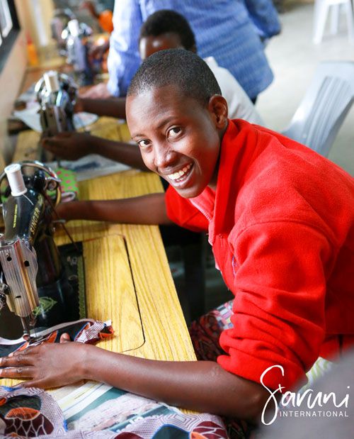 Saruni International participant using a sewing machine
