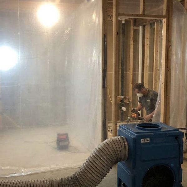 thick plastic dust barriers and a HEPA air scrubber