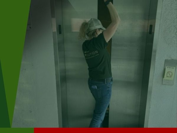 worker opening broken elevator
