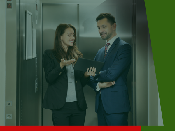 Two people in an elevator Two people in an elevator