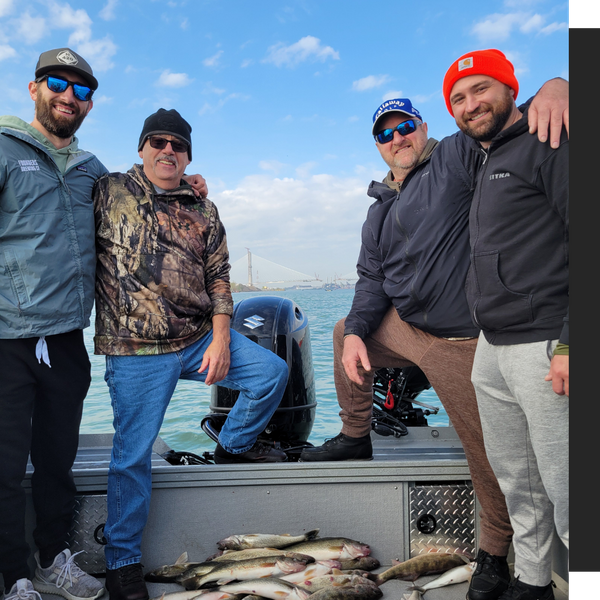 group of men standing with their catch group of men standing with their catch
