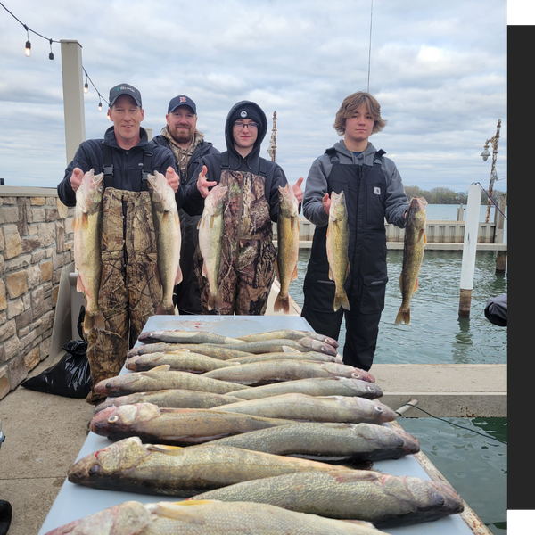 men and sons standing next to their catch men and sons standing next to their catch