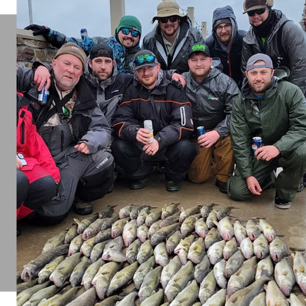 group of fishers crouched next to their catch