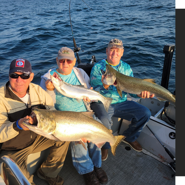 men on a boat holding up big fish they caught men on a boat holding up big fish they caught