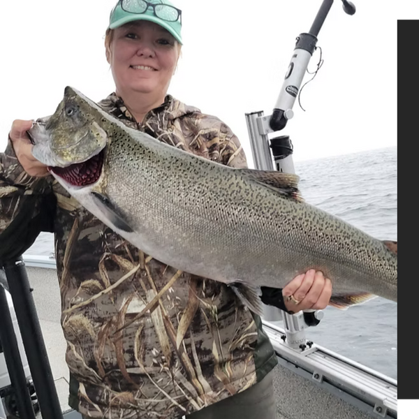 man holding up a big fish man holding up a big fish