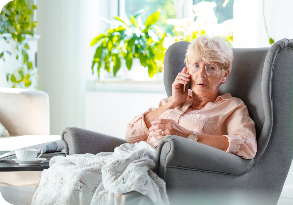 elderly woman talking on phone in recliner